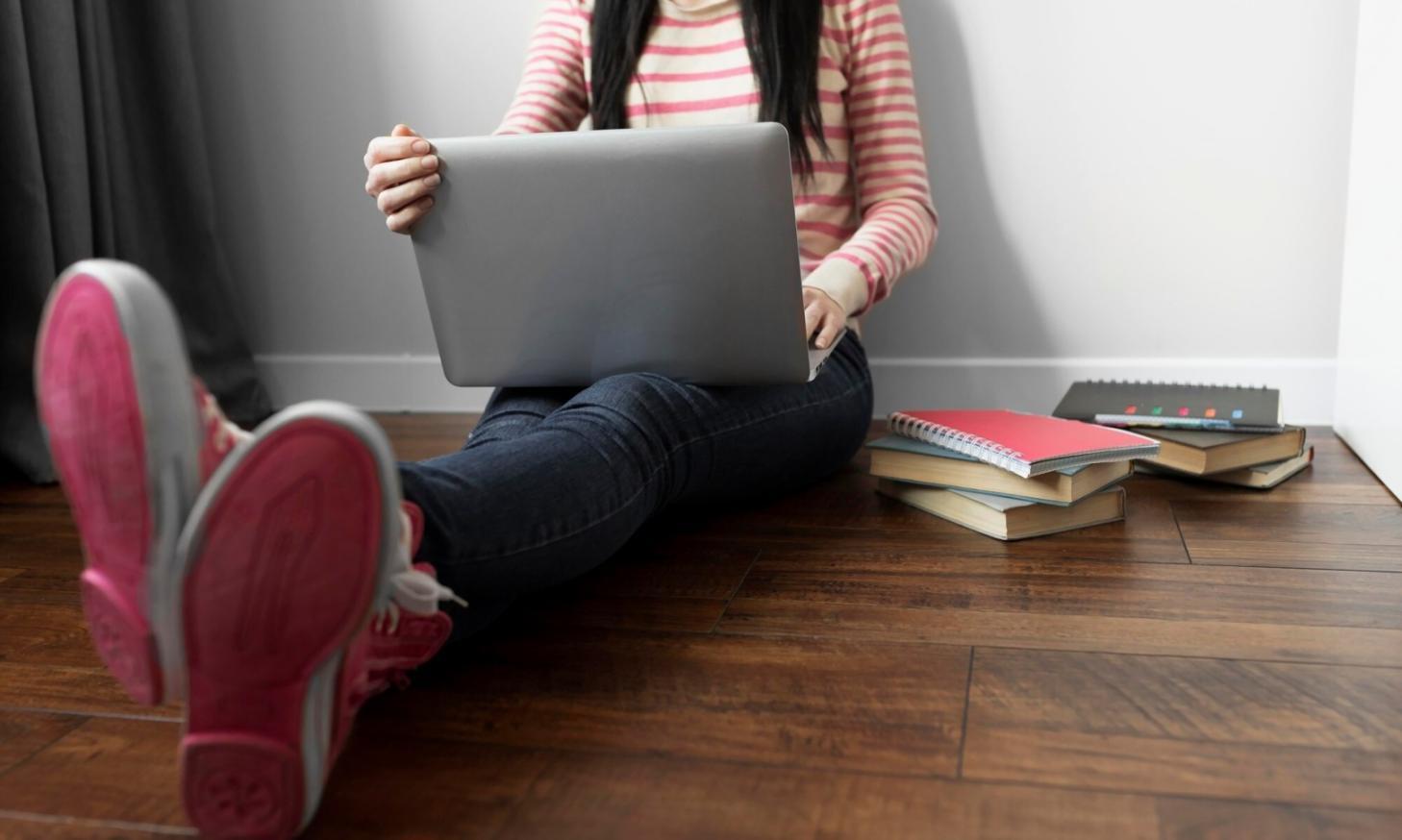 Students presenting final projects to industry professionals in classroom setting