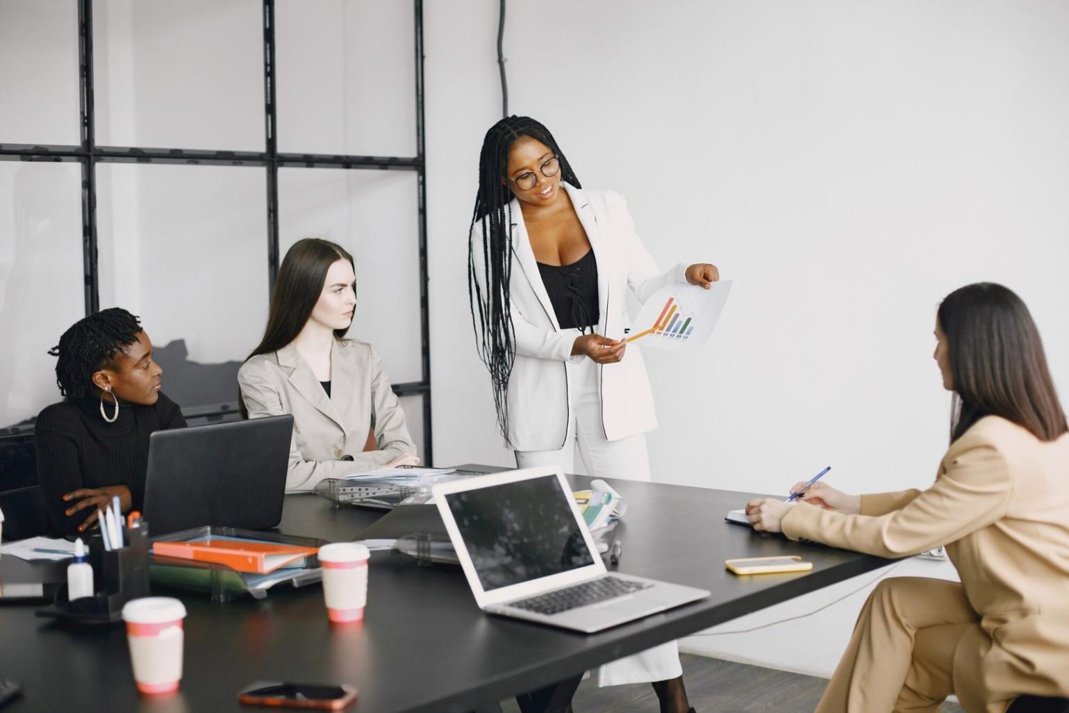 Students collaborating on programming projects in modern learning environment
